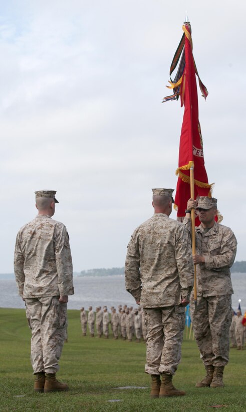 Sgt. Maj. Michael J. Rowan presents colors to Lt. Col. David G. Bardorf, who will pass the colors to  Lt. Col. Harry L. Gardner, symbolizing the passing of command from the outgoing commanding officer to the incoming aboard Marine Corps Base Camp Lejeune June 21.Bardorf is heading to the Marine Corps War College for a year of training.