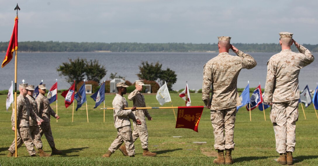 Headquarters and Support Battalion's troops march past  Lt. Col. David G. Bardorf and  Lt. Col. Harry L. Gardner, the battalion's outgoing and incoming comanding officers in a pass in review during the battalion's change of command ceremony aboard Marine Corps Base Camp Lejuene June 21. Bardorf is heading to the Marine Corps War College for a year of training.