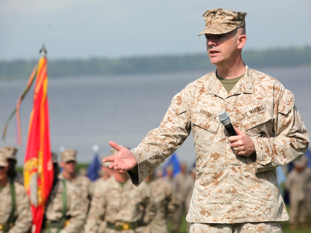 Lt. Col. Harry L. Gardner, the incoming commanding officer Headquarters and Support Battalion, speaks to guests during his change of command ceremony aboard Marine Corps Base Camp Lejeune June 21. Gardner deployed with Operation Desert Shield and Operation Desert Storm during which he received a purple heart for wounds received in action