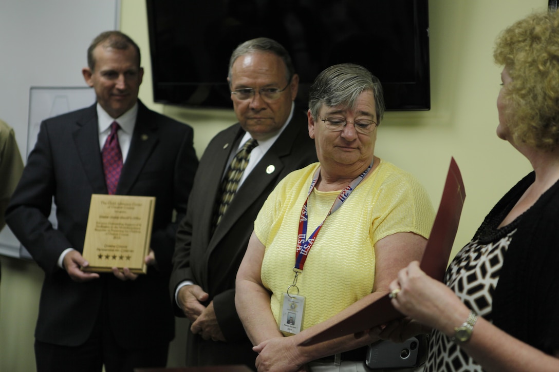 Captain Pam Sanders of the Onslow County Sheriff's Office was honored with the Champion of Children award at a recent regnition ceremony hosted by the Child Advocacy Center of Onslow County. Naval Criminal Investigative Services, Onslow County Sheriff's Office, Jacksonville Police Department, Onslow County Department of Social Services, Onslow County District Attorneys Office and the Guns-and-Hoses Comittee were also honored at the ceremony. 