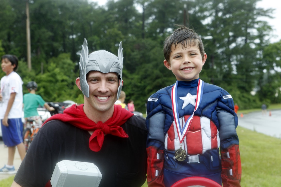 1st Lt. Patrick Callahan, with Marine Wing Support Squadron 271, ran Tarawa Terrace Community Center’s Superhero Fun Run with his son while dressed as comic books heroes, June 22. While it is encouraged, participants are not required to dress up according to the fun run’s monthly theme.