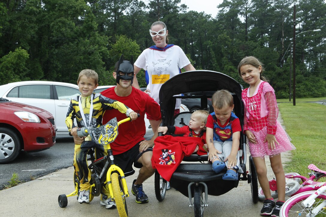 Marc and Norene Kleihauer used the event to teach their children about physical fitness while spending time together as a family at races hosted by the Tarawa Terrace Community Center, June 22. Runs with a theme, such as this month’s superhero run make the runs more exciting for their children.