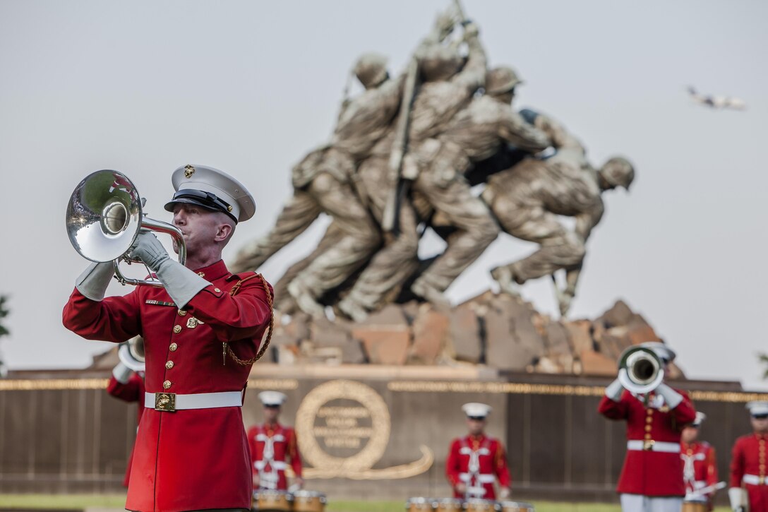 Gunnery Sgt. David Toothman, a U.S. Marine Drum & Bugle Corps member, performs during a Tuesday Sunset Parade at the Marine Corps War Memorial in Arlington, Va., June 25. 