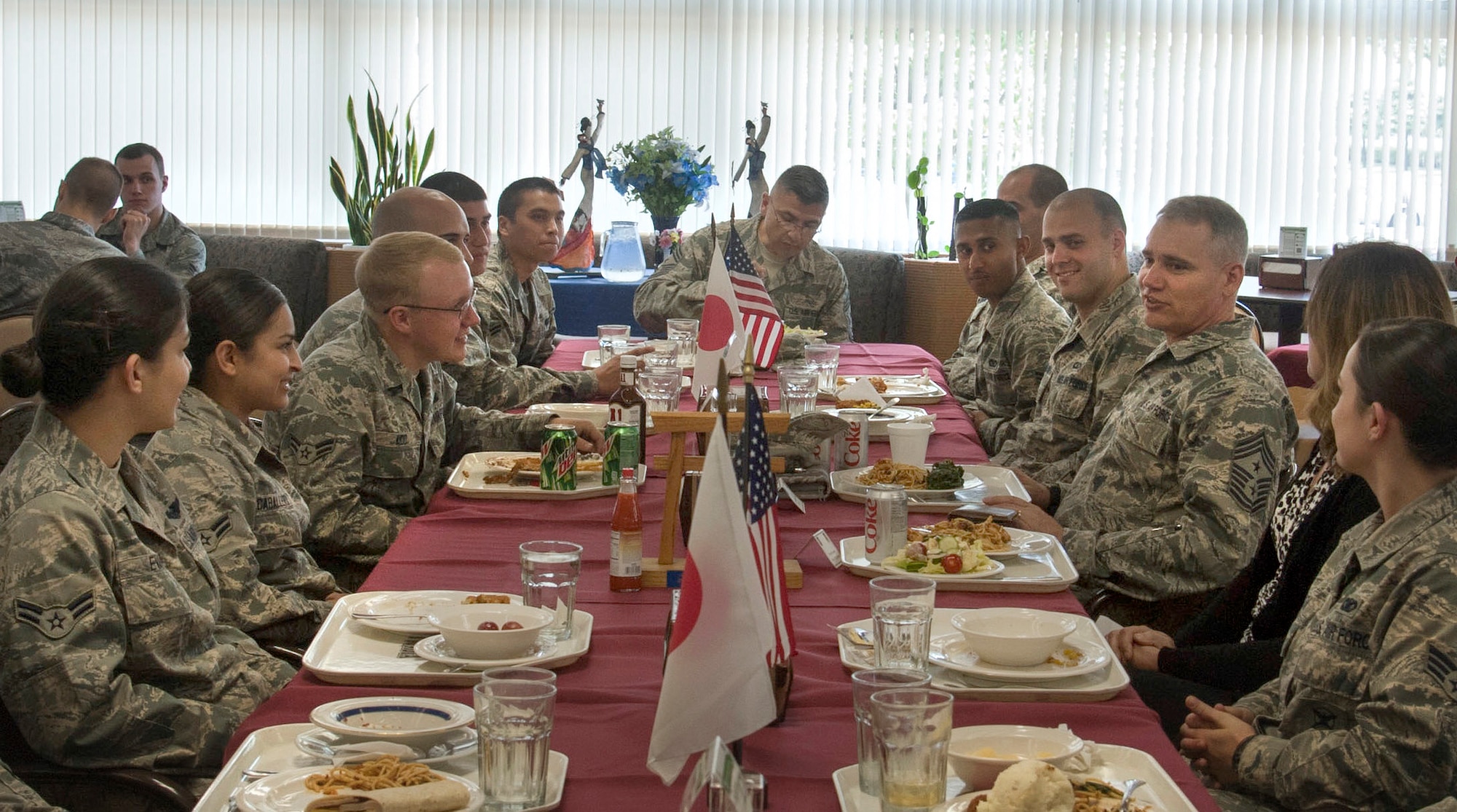 U.S. Forces, Japan and 5th Air Force Command Chief Master Sgt. James Laurent (center right), and his wife, Terri, have lunch with Airmen at the Samurai Café Dining Facility at Yokota Air Base, Japan, June 4, 2013. (U.S. Air Force photo by Airman 1st Class Soo Kim)