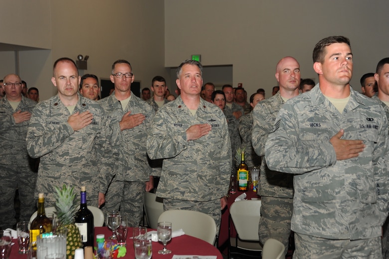 Oregon Airmen of the Combat Operations Group stand for the Pledge of Allegiance during a combat dinning-in event at Camp Rilea, Ore., June 22, 2013. (Air National Guard photo by Tech. Sgt. John Hughel, 142nd Fighter Wing Public Affairs)The training was held over a five-day period in which the Combat Operations Group (COG) made up of four individual Oregon Air Guard units; 125th STS, 116th ACS, 270th ATCS and the 123rd WF. The focus of the training was to build unit morale, establish new professional networks and enhance military development. (Air National Guard photo by Tech. Sgt. John Hughel, 142nd Fighter Wing Public Affairs)