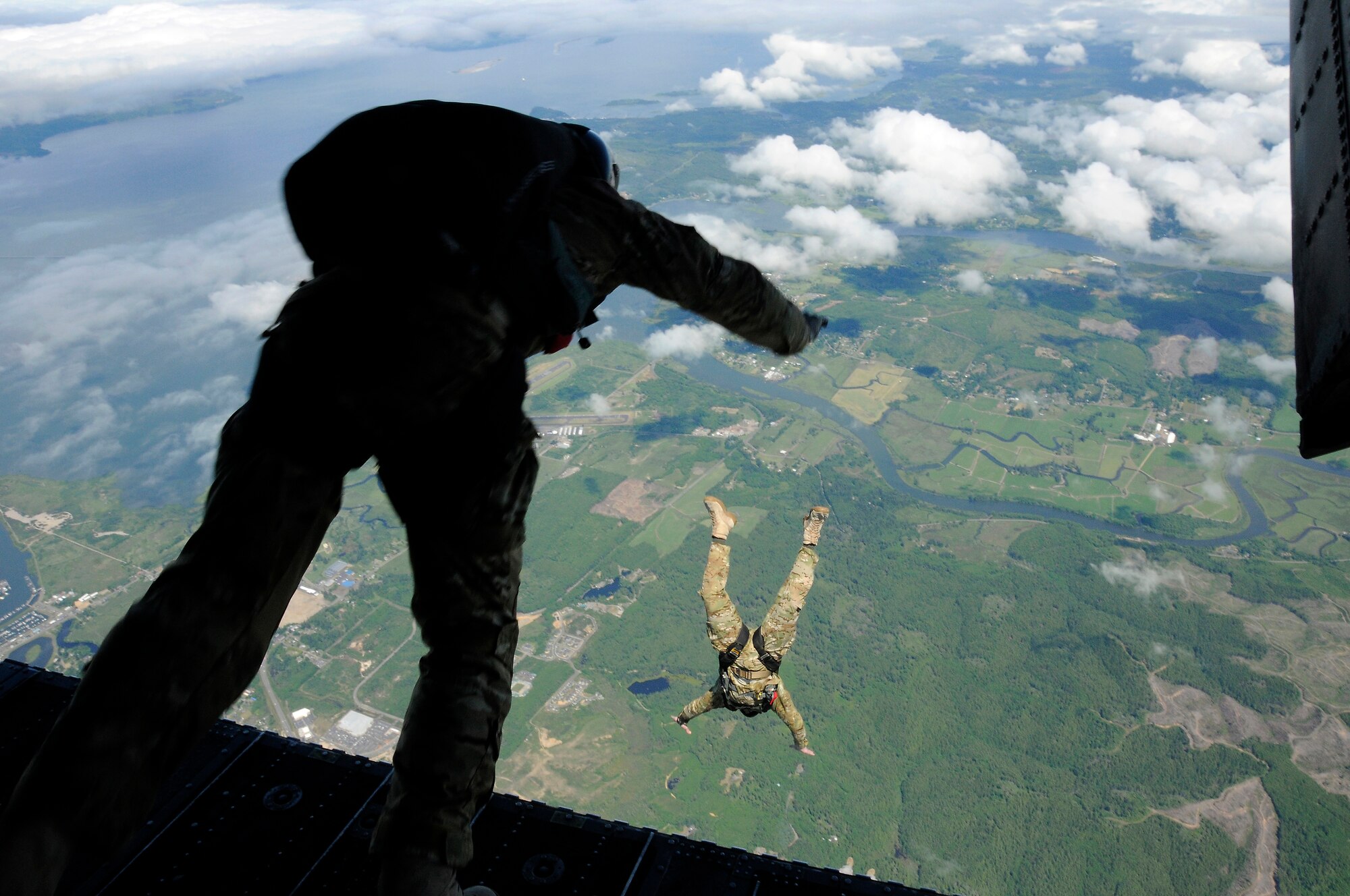 Oregon Air National Guard members of the 125th Special Tactic Squadron make their jumps from a CH47 Chinook helicopter over Camp Rilea, Ore., June 21, 2013. (Air National Guard photo by Tech. Sgt. Emily Thompson, 142nd Fighter Wing Public Affairs).