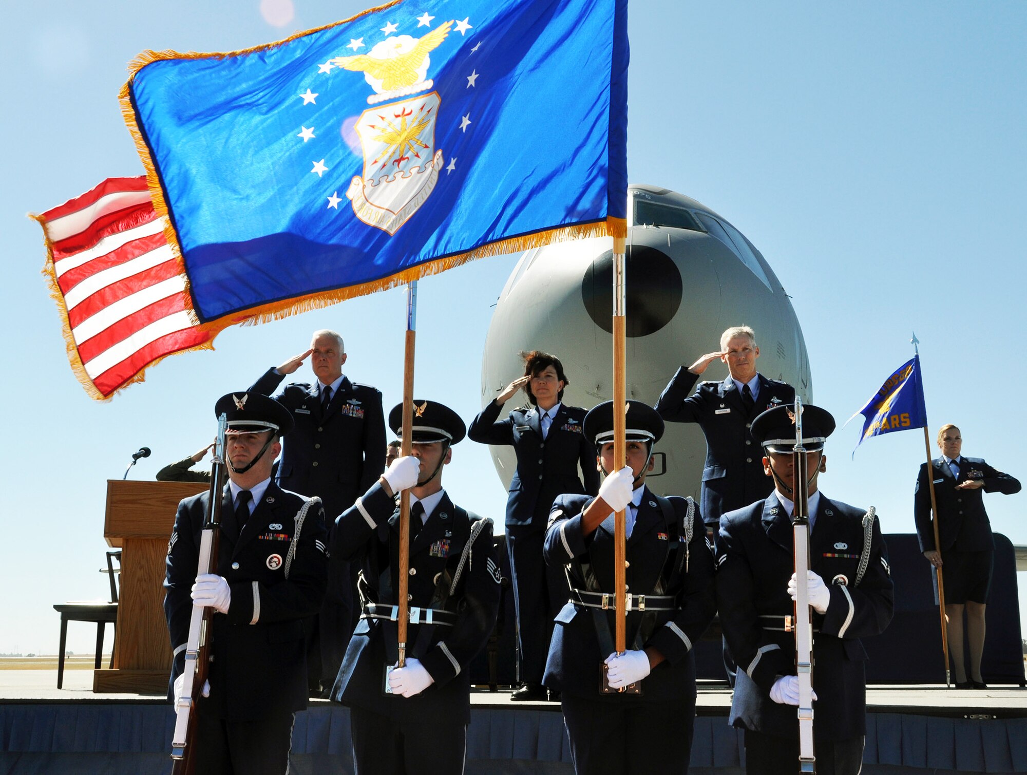 TRAVIS AIR FORCE BASE, Calif. -- Col. Scott L. McLaughlin, 349th Air Mobility Wing Operations Group commander, Lt. Col. Jeanine McAnaney, the outgoing 70th Air Refueling Squadron commander and Lt. Col. Thomas Corcoran, the incoming 70th ARS commander salute the colors during the 70 th ARS change of command ceremony on June 22, 2013. (U.S. Air Force photo / Senior Airman Cindy Alejandrez) 

