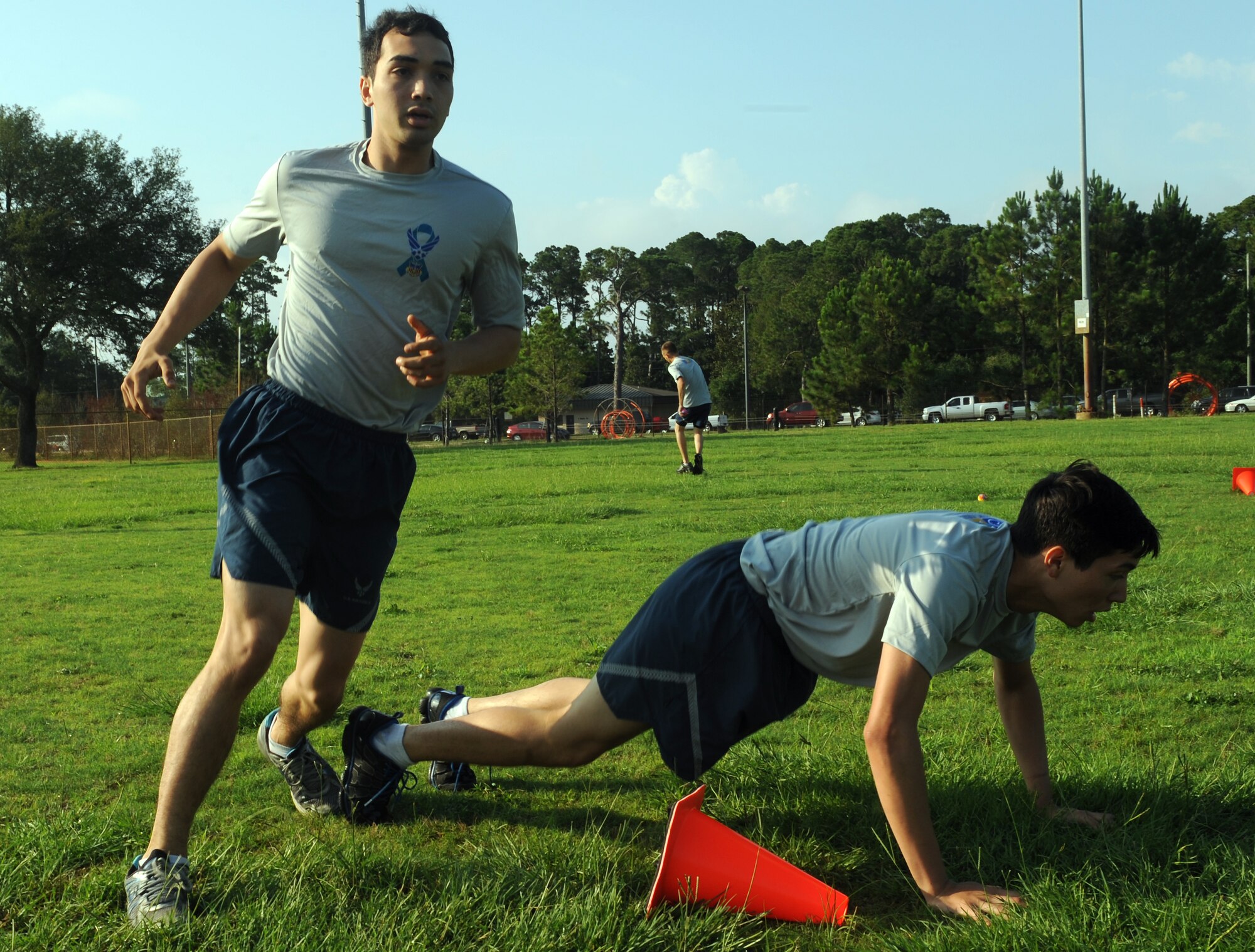Airman 1st Class Jorge Reyes, a storage and issue apprentice for the 1st Special Operations Logistics Readiness Squadron, runs around a member of his team while dodging water balloons during the ‘Air Commandos Versus Sexual Assault’ obstacle course, held near Child Development Center Main on Hurlburt Field, Fla., June 21, 2013. Failure to dodge the balloons meant being penalized with pushups. (U.S. Air Force photo by Senior Airman Kentavist P. Brackin)