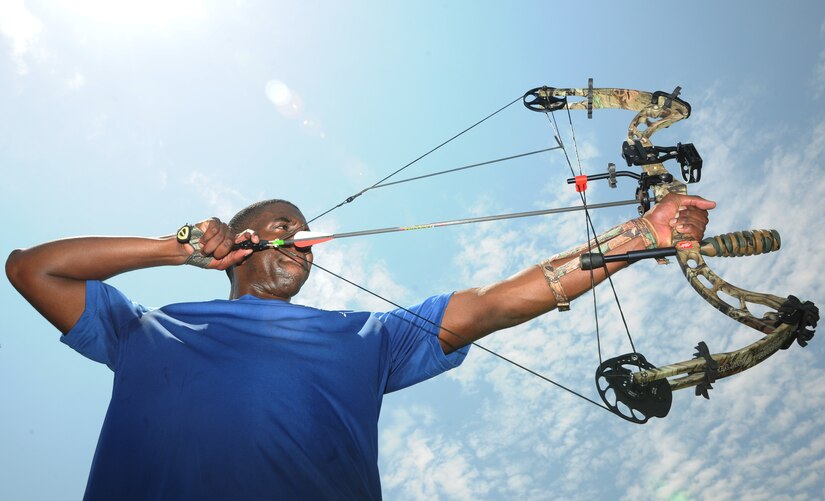 Staff Sgt. Alexander Tonic, from the 32nd Intelligence Squadronat Fort Meade, Md., draws back a compound bow at the archery range at Joint Base Andrews, Md., June 26, 2013. Tonic is a participant in an Air Force Wounded Warriors Adaptive Sports Camp, a program designed to help Air Force warriors get back in the game of life through physical activity. (U.S. Air Force photo/Airman 1st Class Aaron Stout)

