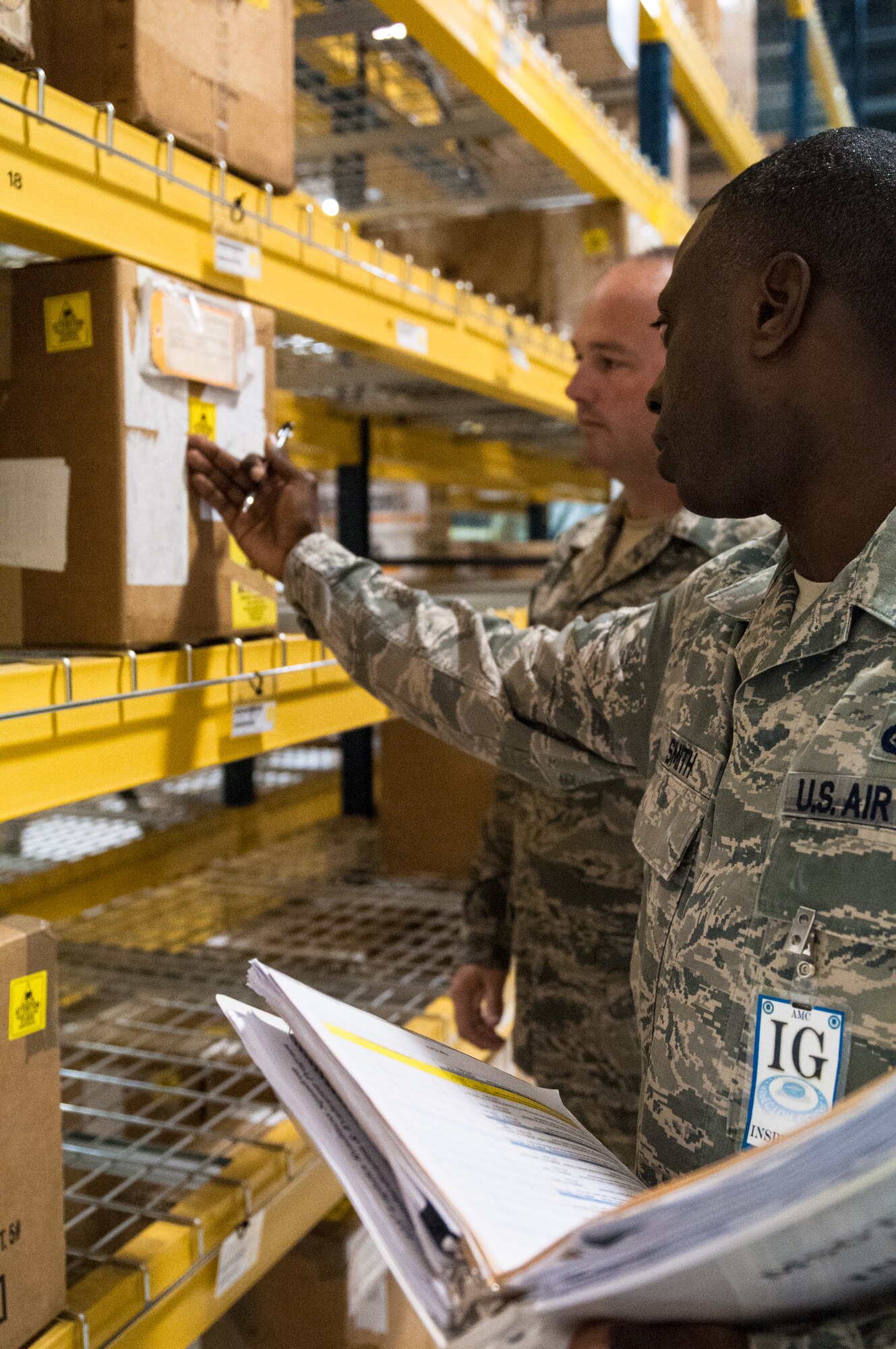 Master Sgt. Carlos Smith, an inspector from Air Mobility Command, discusses inventory labeling procedures with Master Sgt. Andrew Bush of the Kentucky Air National Guard’s 123rd Logistics Readiness Squadron during an evaluation of the 123rd Airlift Wing supply warehouse in Louisville, Ky., May 19, 2013. The wing underwent a multi-disciplinary Consolidated Unit Inspection from May 15 to 22. (U.S. Air National Guard photo by Senior Airman Vicky Spesard)