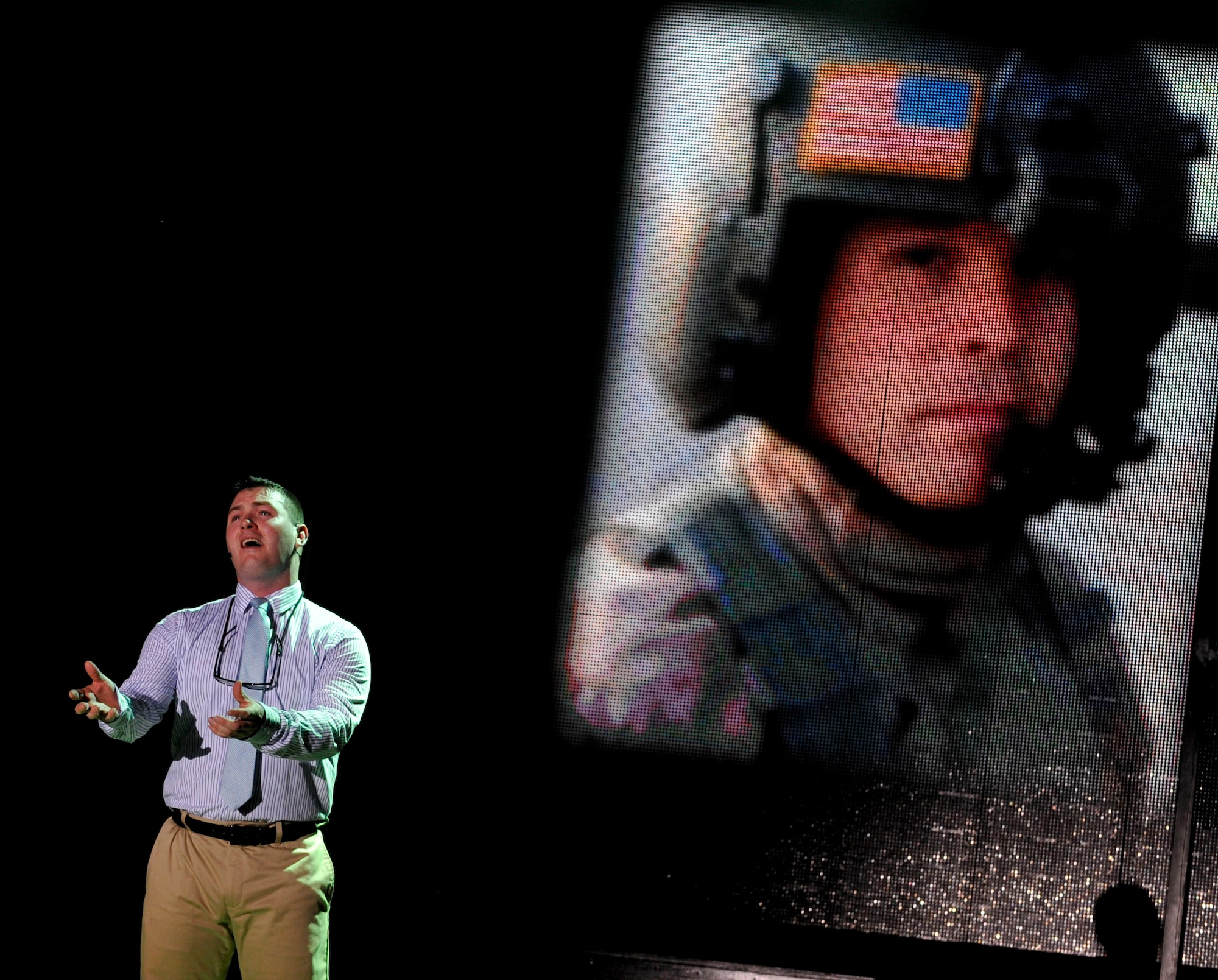 U.S. Army Sgt. Michael Polmanteer, 2013 Army Soldier Show cast member, performs during the blue star tribute portion of the show at Fort Eustis, Va., June 25, 2013. The blue star portion of the show pays tribute to families who currently have a loved one serving abroad. (U.S. Air Force photo by Staff Sgt. Wesley Farnsworth / Released)