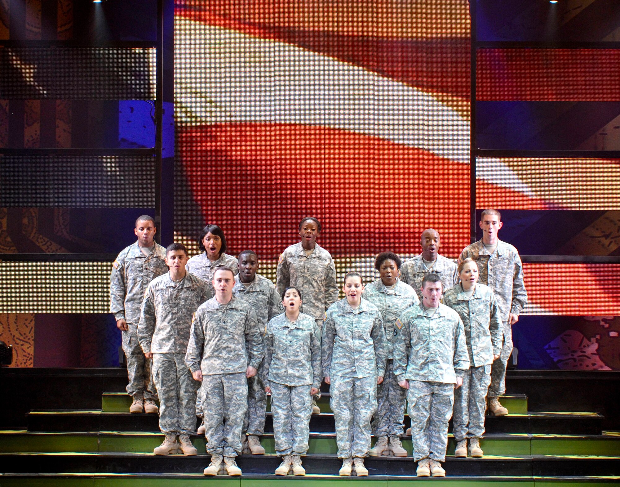 Cast members with the 2013 Army Soldier show perform Irving Berlin’s “God Bless America,” during their show at Fort Eustis, Va., June 25, 2013. The 75-minute show, “Ready and Resilient,” is performed by active duty, reserve and National Guard Soldiers. (U.S. Air Force photo by Staff Sgt. Wesley Farnsworth / Released)