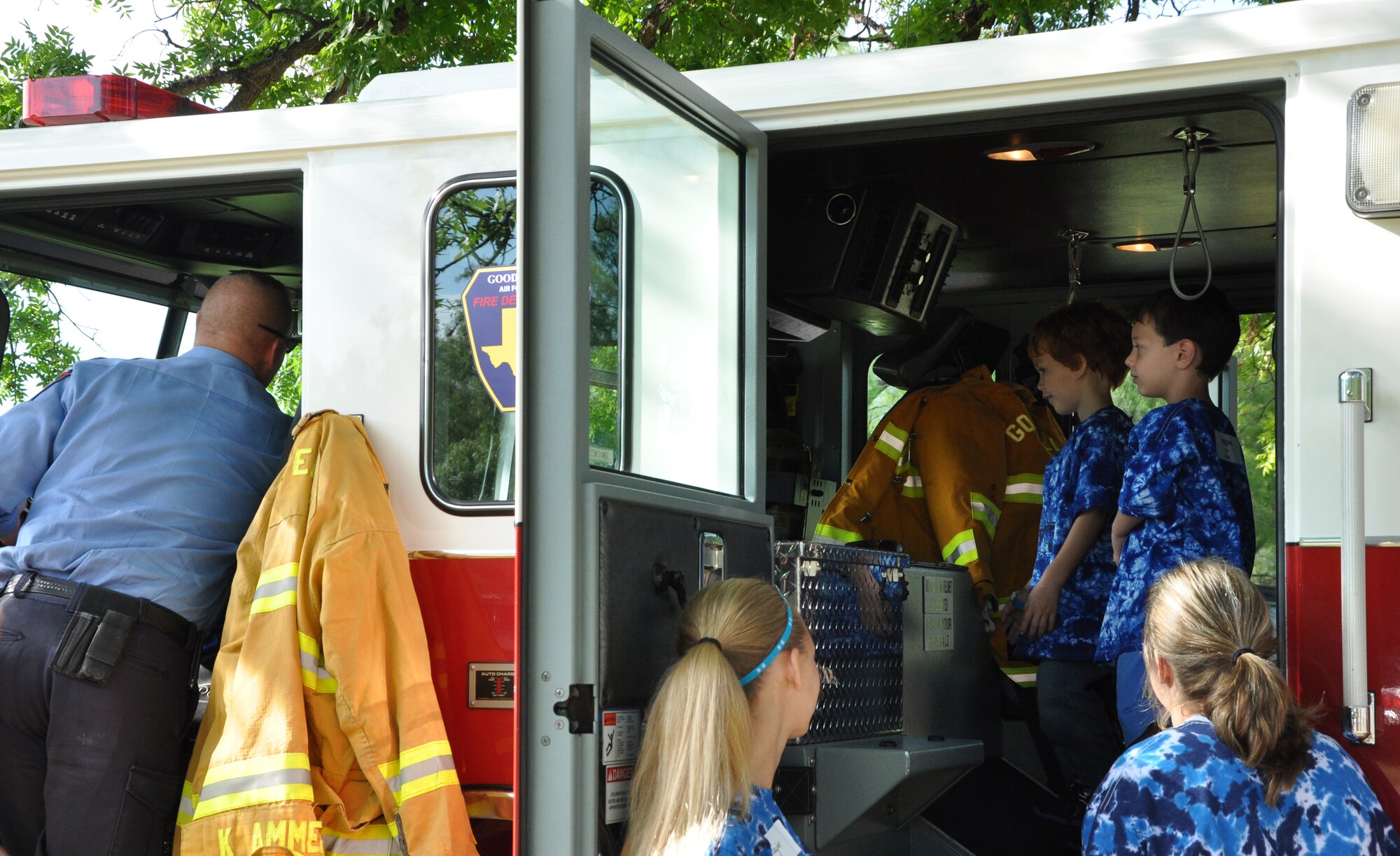 SAN ANGELO, Texas - Participants of the 35th annual West Texas Rehabilitation Center Summer Camp explore a Goodfellow Fire Truck, June 18. The Goodfellow Fire Department brought the fire truck as support for the children with special needs attending the camp. (U.S. Air Force photo/ Airman 1st Class Erica Rodriguez)