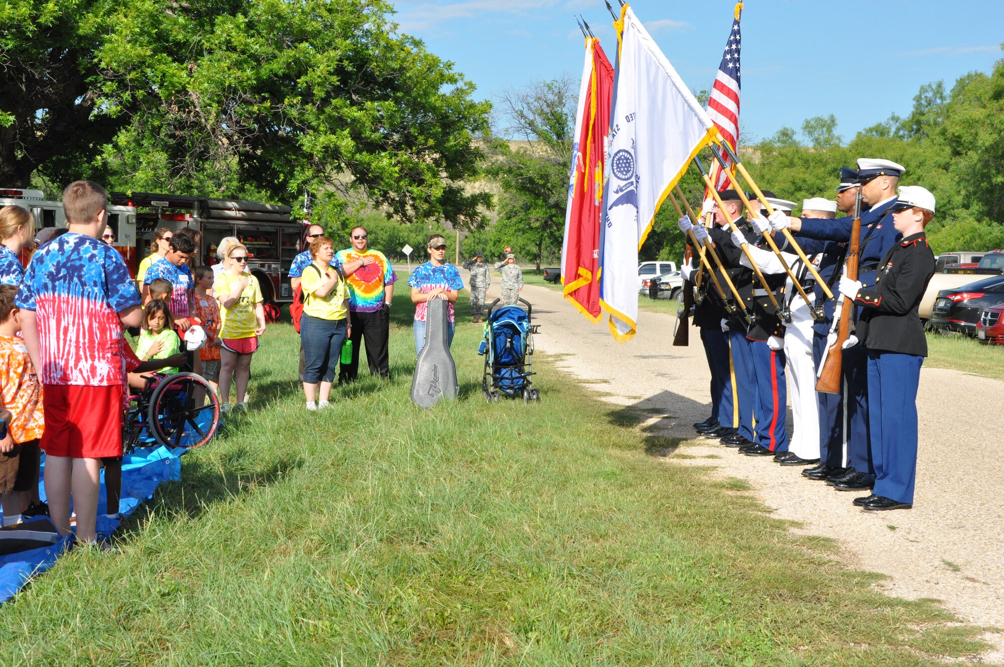 SAN ANGELO, Texas- The Goodfellow base Honor Guard presents the colors at the 35th annual West Texas Rehabilitation Center Summer Camp, June 18. The participants sang the national anthem and said the Pledge of Allegiance. (U.S. Air Force photo/ Airman 1st Class Erica Rodriguez)