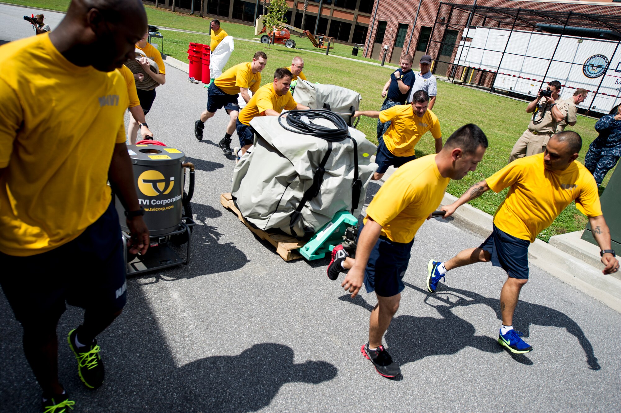 Sailors from the Navy Health Clinic Charleston race to begin their final "timed" exercise during the second day of the First Receivers Operation Training course June 21, 2013, at Joint Base Charleston - Weapons Station, S.C.  The 16-hour course consisted of one, eight-hour day of class lecture and a second eight-hour day of "hands-on" teamwork training to include a final "timed" exercise. NHCC team’s mission capable time was three minutes and forty-six seconds. Their set up completion time was seven minutes and fifteen seconds. They exceeded U.S. Navy standard times despite being their first time training with the equipment. (U.S. Air Force photo/Staff Sgt. Rasheen Douglas)