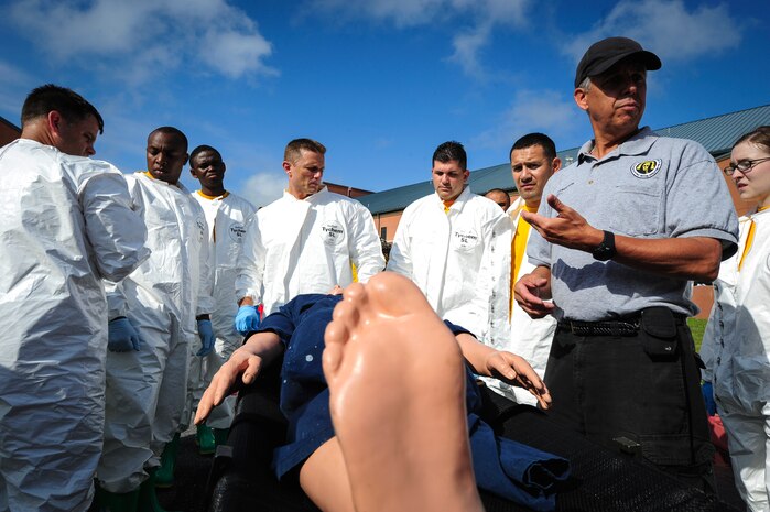 Charlie Jenson, Decontamination Education and Consulting on Nuclear/Bio/Chemical instructor, briefs Sailors from the Navy Health Clinic Charleston on how to prepare patients for decontamination during a First Receivers Operation Training course June 21, 2013, at the Joint Base Charleston - Weapons Station, S.C. The NHCC team participated in the FROT course to educate their Sailors on life-saving skills consisting of triage, initiate field treatment, decontaminate and save victims from Chemical, Biological, Radiological/Nuclear, or Hazardous Material. The 16-hour course consisted of one, eight-hour day of class lecture and a second eight-hour day of "hands-on" teamwork training to include a final "timed" exercise. (U.S. Air Force photo/Staff Sgt. Rasheen Douglas)