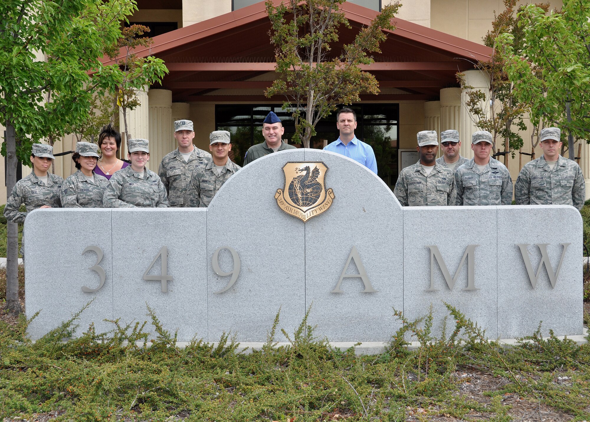 TRAVIS AIR FORCE BASE, Calif. -- The 349th Air Mobility Wing welcomed 12 new members to the wing during June B-flight. (U.S. Air Force photo / Senior Master Sgt. Robert Wade)