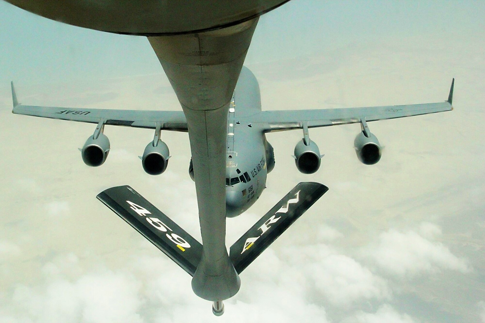 WRIGHT-PATTERSON AIR FORCE BASE, Ohio – A KC-135 Stratotanker from the 459th Air Refueling Wing, Joint Base Andrews, Md., refuels a C-17 Globemaster III over Southwest Asia. The C-17 is being flown by members of the 89th Airlift Squadron currently augmenting an active duty crew while deployed with the 385th Air Expeditionary Group, Detachment 1. (Courtesy photo)