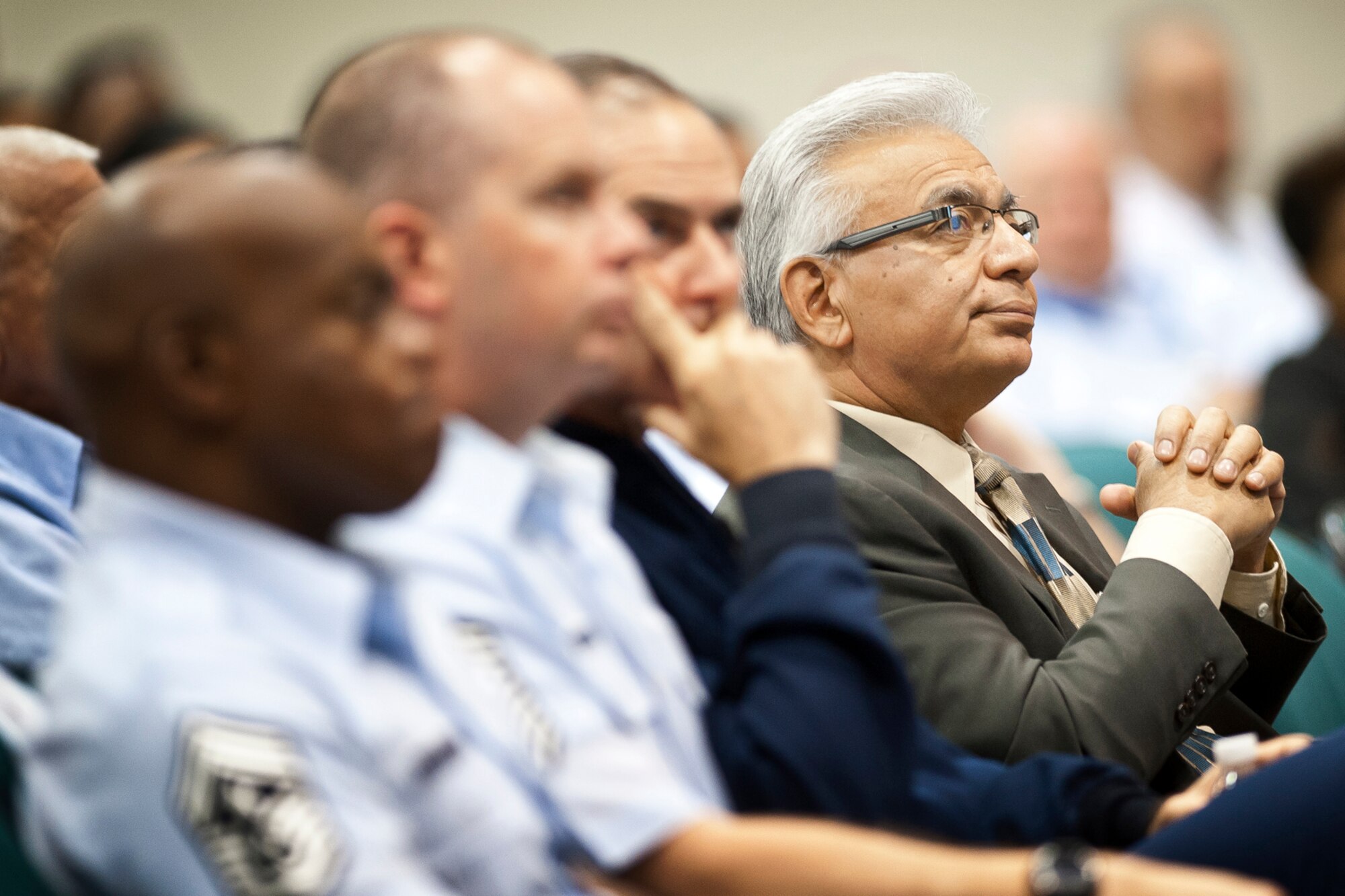 Mr. Rich Rico, the director of staff for the Air National Guard Readiness Center listens while Col. Doug Slocum, the chief of Safety speaks to Airmen and other ANG personnel during a Sexual Assault Prevention and Response stand-down at Joint Base Andrews, Md., June 25, 2013. The purpose of the SAPR stand-down is to foster a climate of accountability while reinforcing the Department of Defense’s position that sexist behavior, sexual harassment, and sexual assault will not be tolerated, condoned or ignored. (U.S. Air National Guard photo by Master Sgt. Marvin R. Preston/RELEASED)
