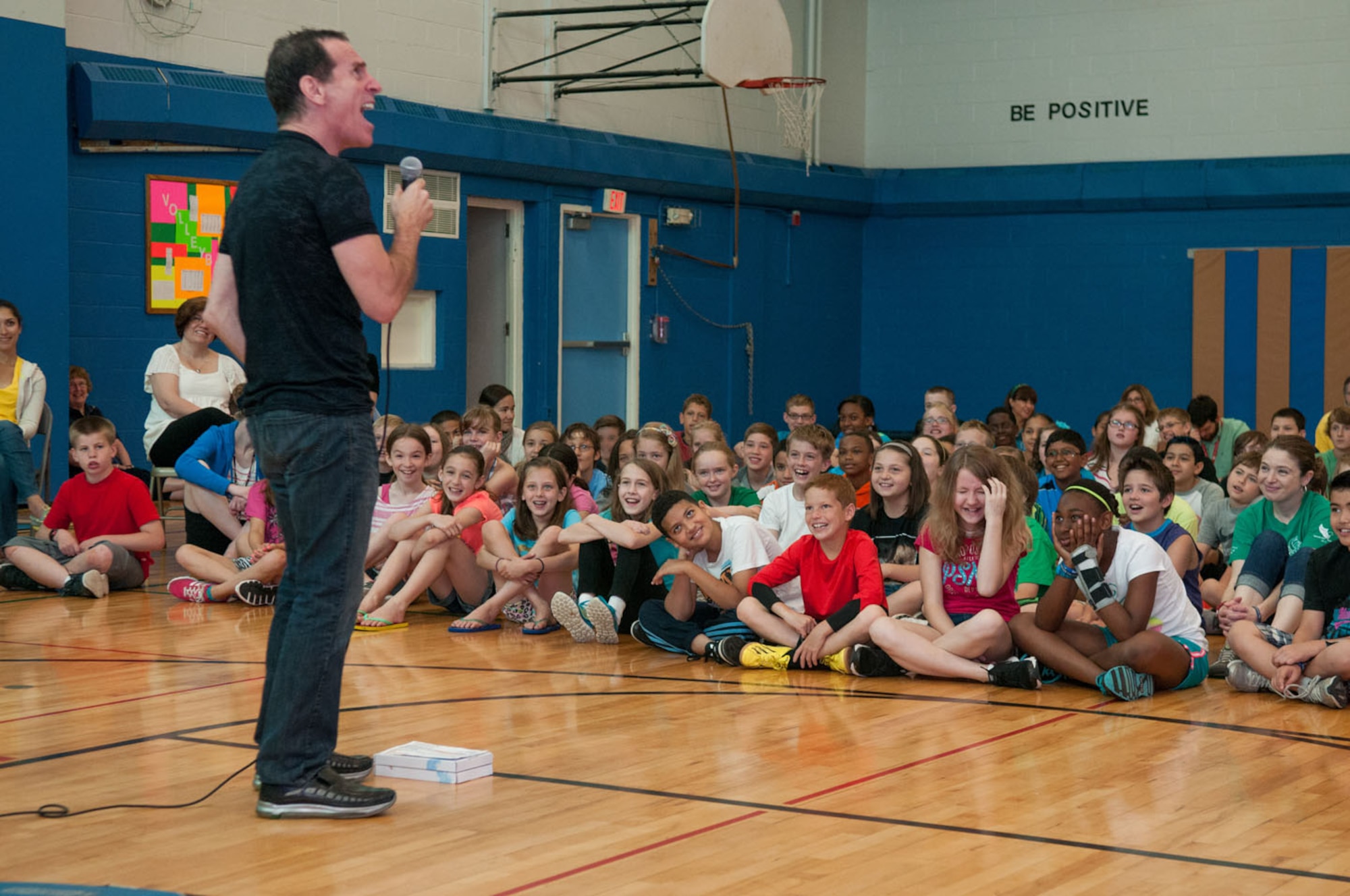 HANSCOM AIR FORCE BASE, Mass. – Trevor Romain, a best-selling author, illustrator and humorist, tells a funny story to children from the Hanscom Middle School June 21. Romain paired up with the USO and travels to bases worldwide speaking to children about the everyday struggles of being in a military family. (U.S. Air Force photo by Rick Berry)