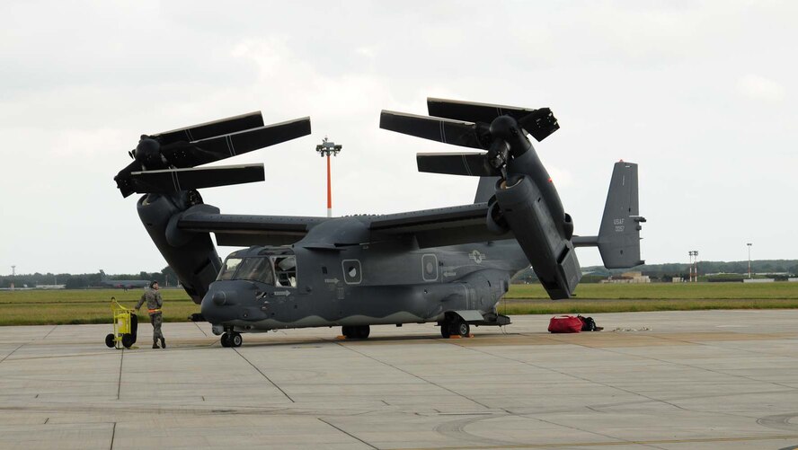 A CV-22B Osprey crew folds the aircraft’s rotor blades after shut-down June 24, 2013, on RAF Mildenhall, England. The CV-22, assigned to the 7th Special Operations Squadron, is the first of 10 slated to arrive as part of the 352nd Special Operations Group expansion, which will last through the end of 2014. (U.S. Air Force photo by Karen Abeyasekere/Released)