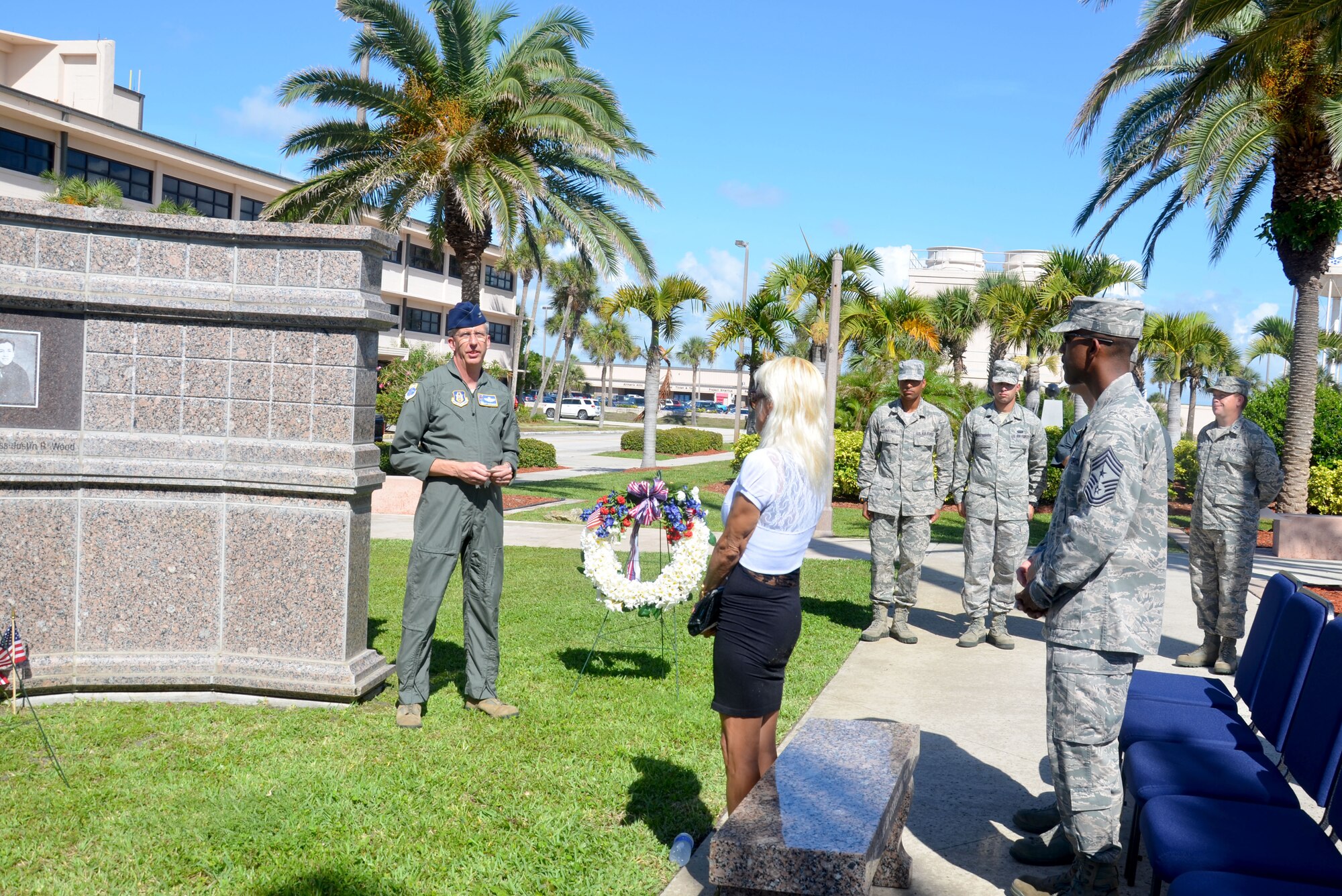 Col. Jeffrey Macrander, 920th Rescue Wing commander, addresses attendees of the remembrance ceremony for the Khobar Tower attacks 17 years ago. Rescue Wing members honored five Rescue Airmen and 14 other Airmen killed. In all, 19 U.S. servicemen and one Saudi were killed and 372 of many nationalities were wounded.  The 920th RQW is an Air Force Reserve combat-search-and-rescue unit comprised of 1,700 Airmen and flies both fixed and rotor wing aircraft. (U.S. Air Force photo/2nd Lt. Leslie Forshaw)