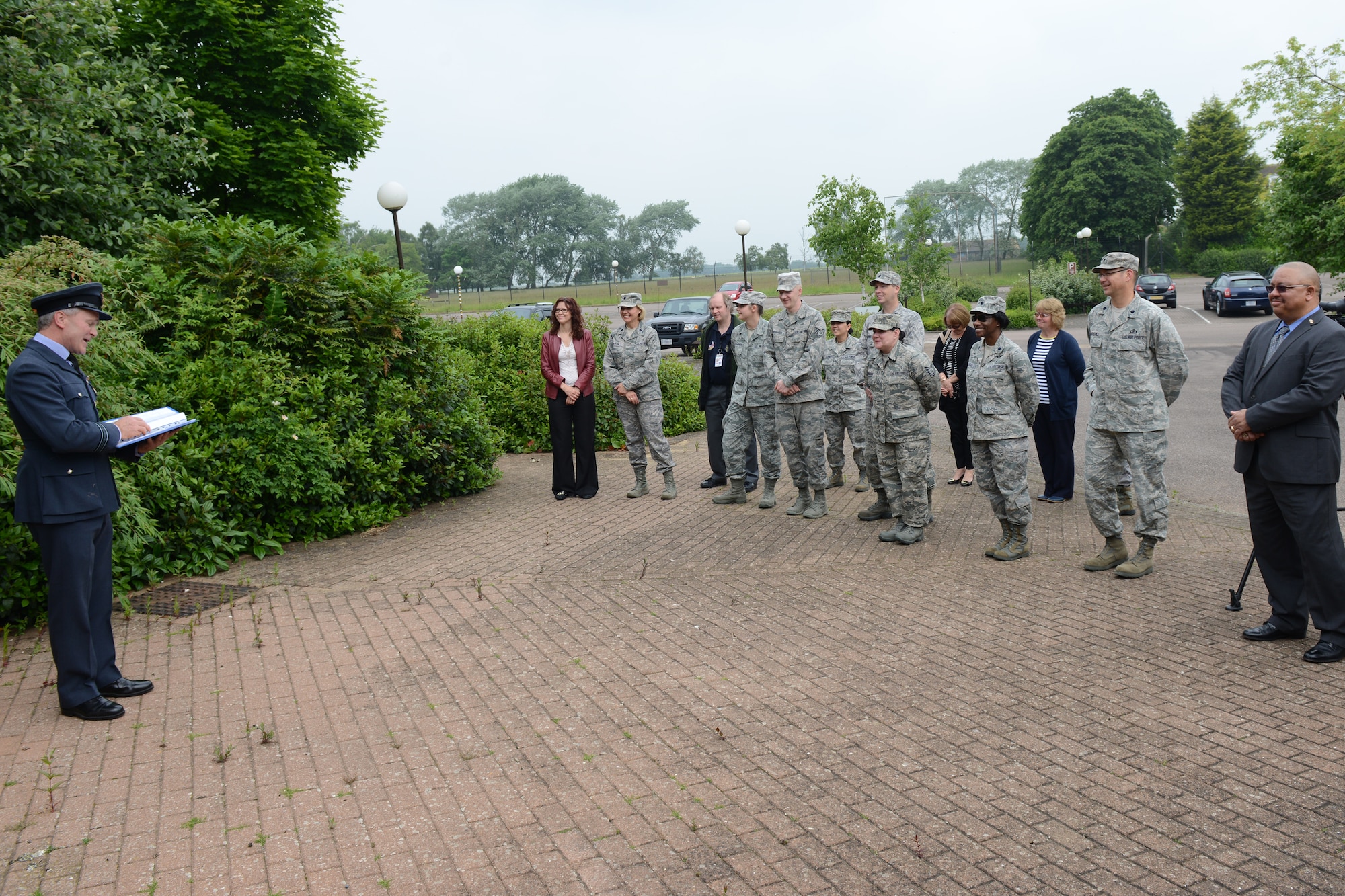RAF UPWOOD, United Kingdom – RAF Squadron Leader Clive Wood, the RAF Commander for RAF Alconbury, RAF Molesworth and RAF Upwood lead a closure ceremony of the former medical clinic at RAF Upwood, June 19, recognized almost 96 years of an Air Force presence at RAF Upwood. (U.S. Air Force photo by Tech. Sgt. Chrissy Best)
