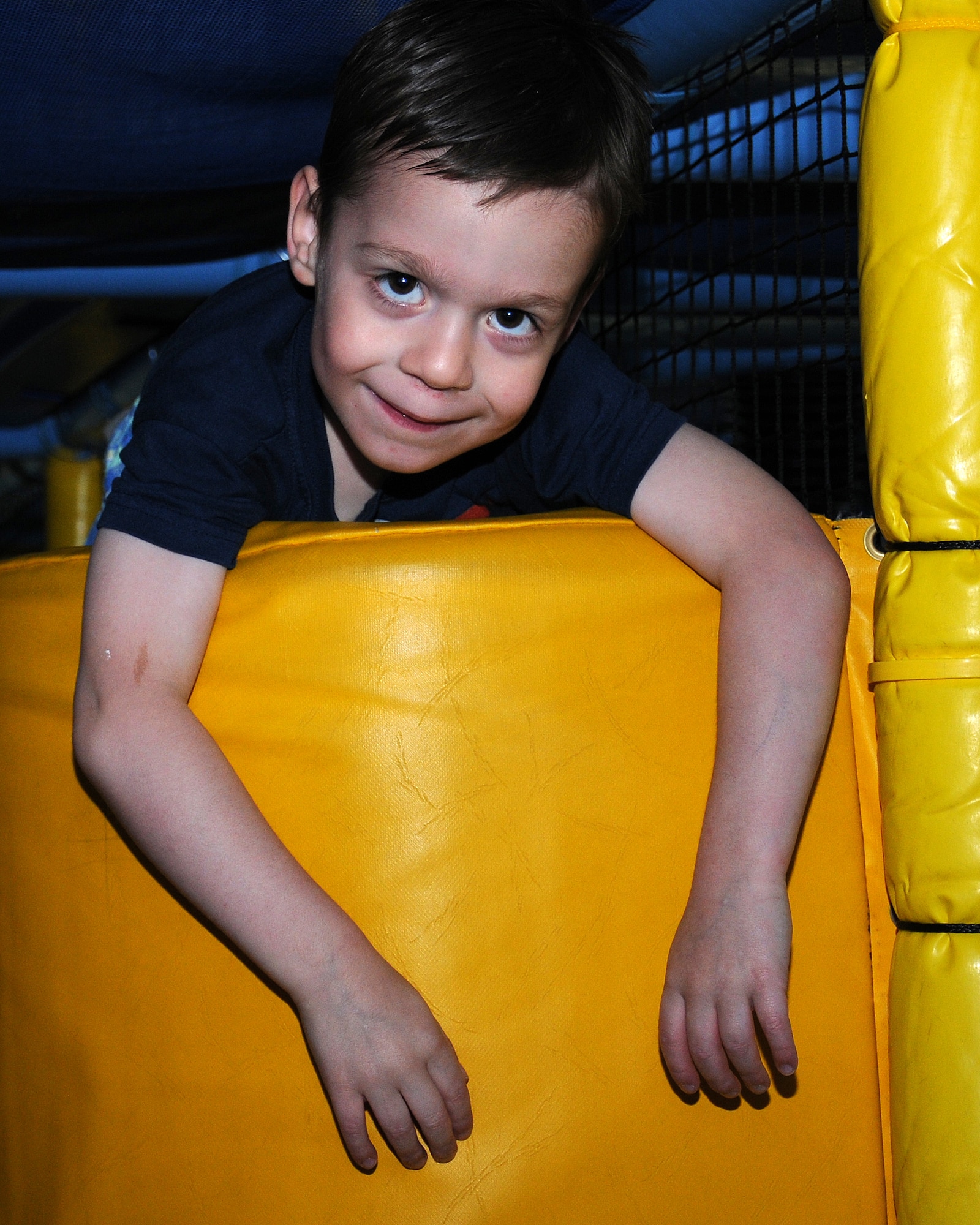 Jerren Byrd, 4, son of Staff Sgt. Jason Byrd, 352nd Special Operations Support Squadron transmission systems supervisor from Houston, Texas, rests after playing games June 26, 2013, in the Fun Zone at the Bob Hope Community Center, on RAF Mildenhall, England. The Fun Zone offers a chance for parents to relax and enjoy a magazine or book while their children play. There is also a treadmill for parents who want to exercise as their child plays. (U.S. Air Force photo by Gina Randall/Released)