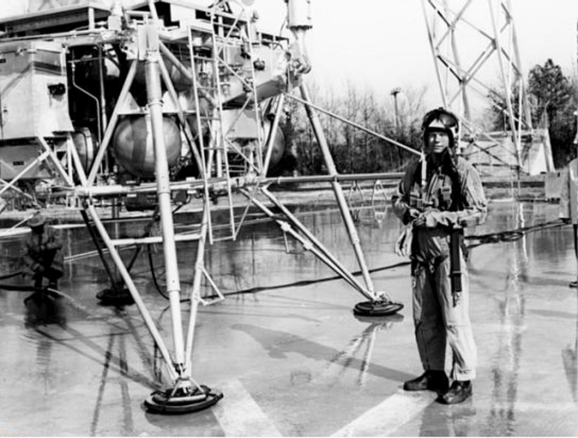 Neil Armstrong, the first man to walk on the moon, stands next to a lunar landing simulator at the National Aeronautics and Space Administration Langley Research Center in Hampton, Va., January 28, 1970. NASA scientists realized a manned capsule would handle drastically differently in the moon’s gravitational atmosphere, which is a sixth of that felt on Earth. Tackling the problem of how to reproduce a low-gravitational environment became NASA’s first step on the road to the moon. (NASA courtesy photo/Released)