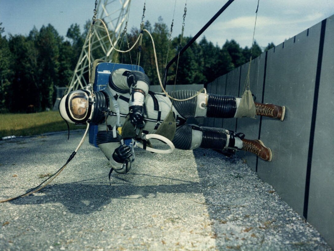 An astronaut uses the Lunar Lander Research Facility to practice walking in a low-gravitational setting similar to the moon in 1965, at the National Aeronautics and Space Administration Langley Research Center in Hampton, Va. While planning the Apollo space program, the success of the program ultimately depended on whether astronauts could learn to safely land on the moon’s surface and return to orbit. (NASA courtesy photo/Released)