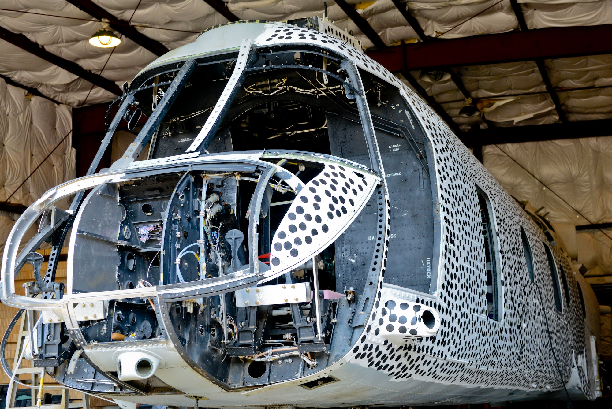 An aircraft awaits testing at the National Aeronautics and Space Administration Langley Research Center Landing and Impact Research Facility in Hampton, Va., June 18, 2013. Each dot painted on the helicopter can be tracked by high-speed cameras to determine post-test information, ultimately used as a baseline for recommendations to institute safety regulations in various agencies. (U.S. Air Force photo by Airman 1st Class R. Alex Durbin/Released)