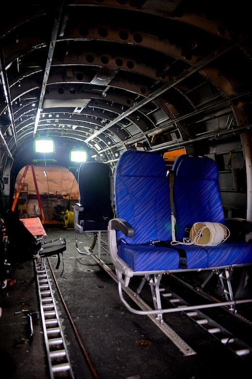 Various types of seating are attached to the inside of a helicopter to be used in an upcoming crash test at the National Aeronautics and Space Administration Langley Research Center Landing and Impact Research Facility in Hampton, Va., June 18, 2013. Information learned from the center’s research has been used as baseline information to institute safety regulations in the military and civilian organizations. (U.S. Air Force photo by Airman 1st Class R. Alex Durbin/Released) 