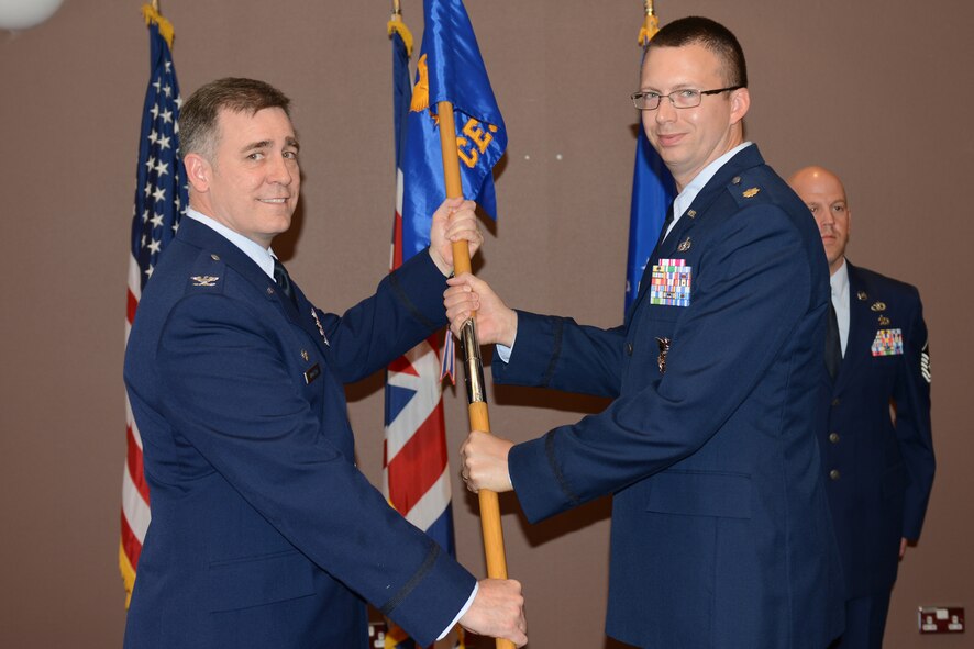 Maj. Matthew Olijnek assumes command of the 422nd Civil Engineer Squadron from Col. Charles Hamilton, 422nd Air Base Group commander, in a change of command ceremony at the Croughton Crown June 25. (U.S. Air Force photo by Tech. Sgt. Chrissy Best)