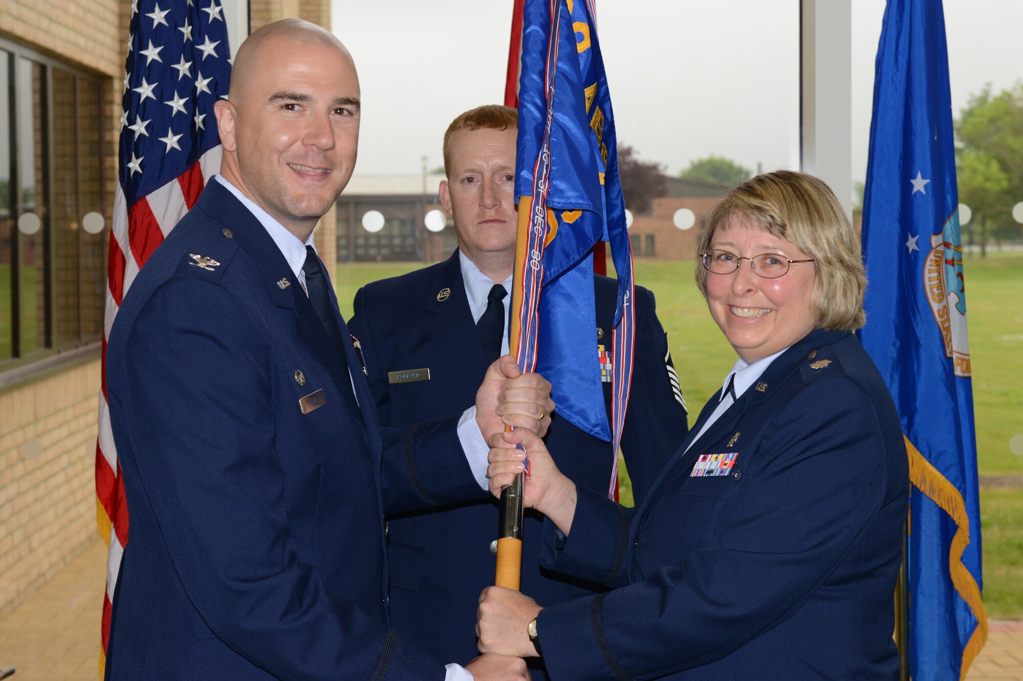 Lt. Col. Vicki Fair assumes command of the 423rd Medical Squadron from Col. Michael Reiner, 423rd Air Base Group commander, in a change of command ceremony at the RAF Alconbury Clinic June 21.