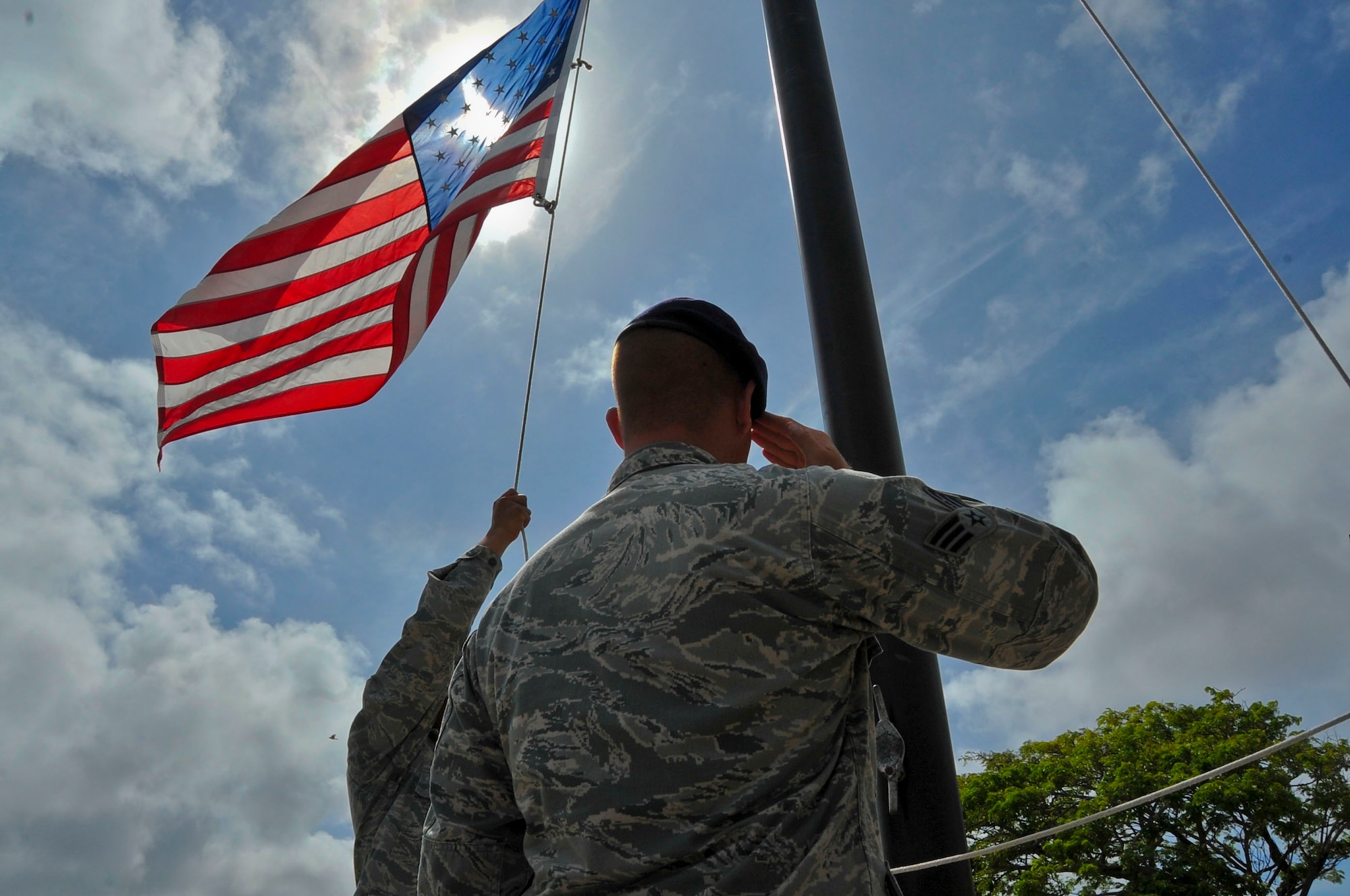 Students from the Andersen Airman Leadership School participate in a retreat ceremony at the end of the duty day on Andersen Air Force Base, Guam, June 19, 2013. During ALS, Airmen hone their knowledge of military customs and courtesies and practice skills like marching formations, flag folding, and reveille and retreat ceremonies. 