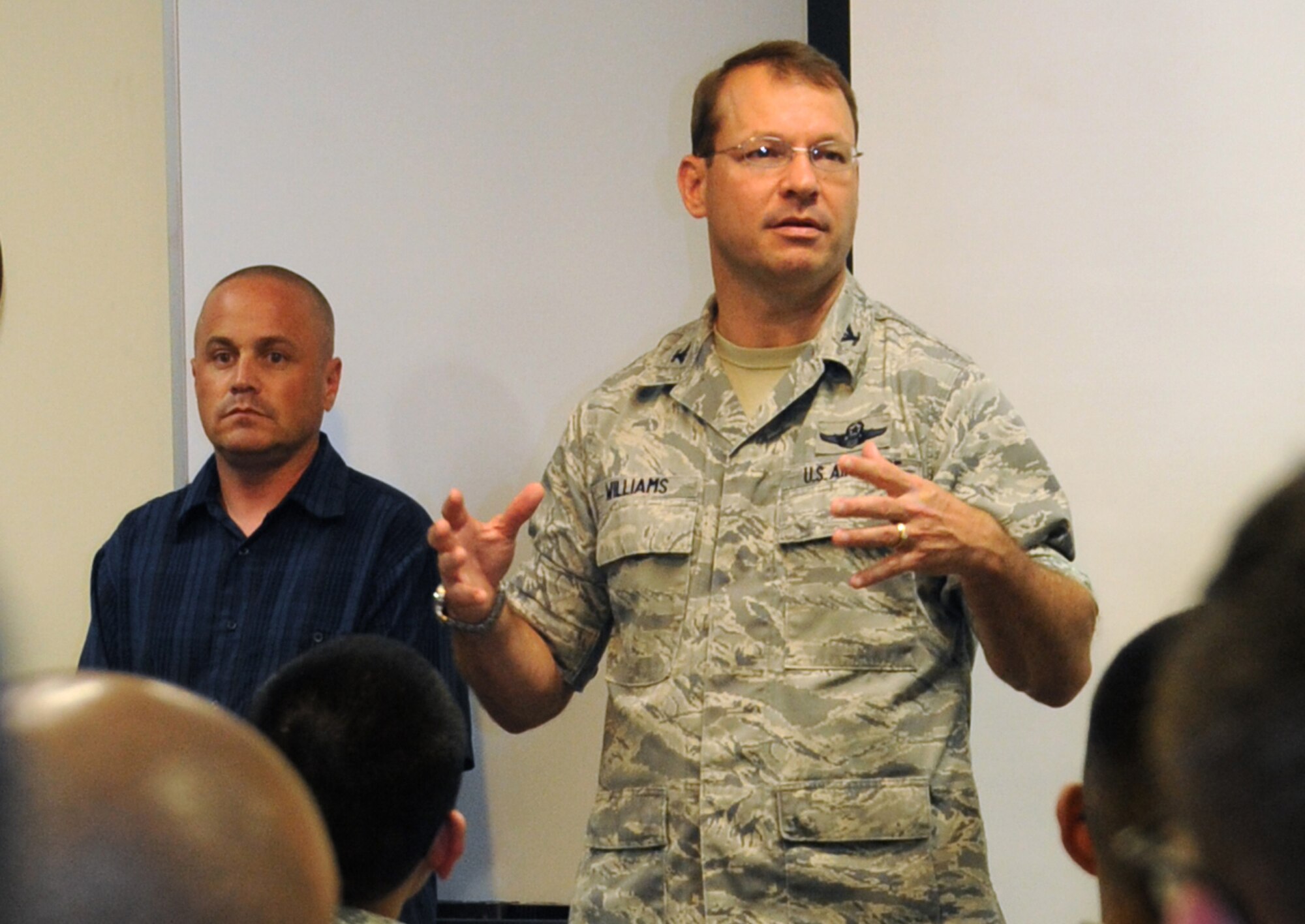 U.S. Air Force Col. Stephen Williams, 35th Fighter Wing commander, addresses swing shift Airmen during a stand-down day for Sexual Assault Prevention and Response training at Misawa Air Base, Japan, June 24, 2013. In order to ensure maximum participation, the day was broken into 13 sessions which consisted of a commander's call and unit-directed training to discuss issues and solutions they have come across regarding sexual assault. (U.S. Air Force photo by Staff Sgt. April Quintanilla)