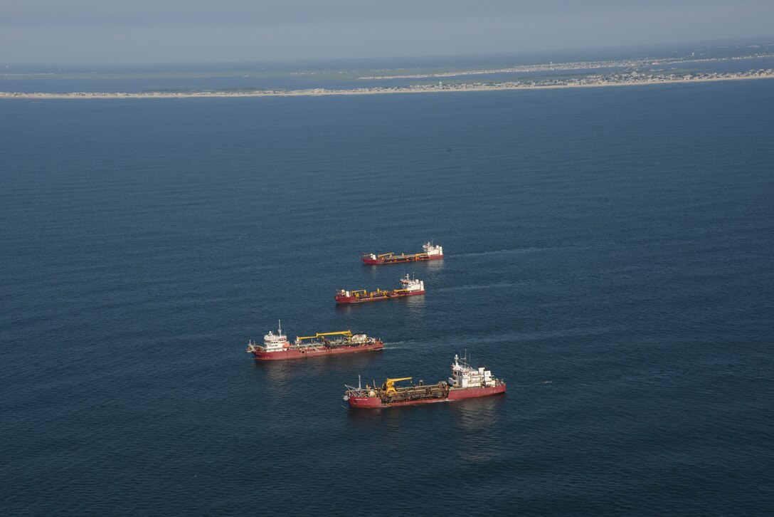 The Dredges Liberty Island (front), Dodge Island, Padre Island and Terrapin Island, of Great Lakes Dredge & Dock Company, transit offshore to dredge sand and pump it onto Long Beach Island, NJ in June of 2013. The work is part of a larger effort by the U.S. Army Corps of Engineers to restore its Coastal Storm Risk Management projects.