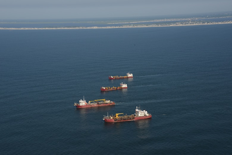 The Dredges Liberty Island (front), Dodge Island, Padre Island and Terrapin Island, of Great Lakes Dredge & Dock Company, transit offshore to dredge sand and pump it onto Long Beach Island, NJ in June of 2013. The work is part of a larger effort by the U.S. Army Corps of Engineers to restore its Coastal Storm Risk Management projects.