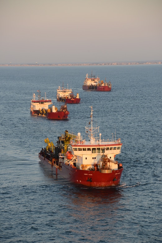 The Dredges Liberty Island (front), Dodge Island, Padre Island and Terrapin Island, of Great Lakes Dredge & Dock Company, transit offshore to dredge sand and pump it onto Long Beach Island, NJ in June of 2013. The work is part of a larger effort by the U.S. Army Corps of Engineers to restore its Coastal Storm Risk Management projects.