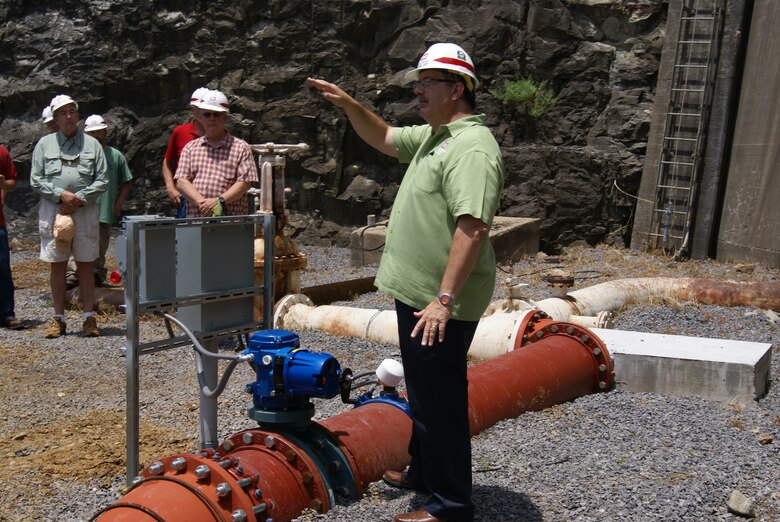 Kent Dunlap, Tulsa District chief of natural resources, explains the low flow pipe system and how it will benefit the fishery below Tenkiller Dam.