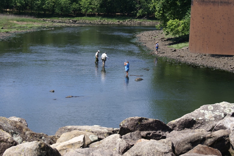 Visitors fish in the steam below Tenkiller Dam. During the summer of 2011 drought, low dissolved oxygen levels and high water temperatures resulted in a fish kill below the dam. 
