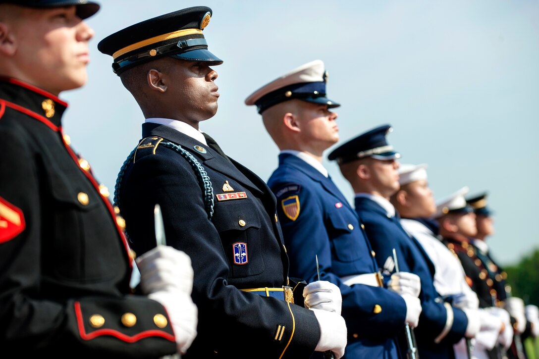 A U.S. military honor guard takes position to welcome Canadian Forces' Chief of the Defense Staff Gen. Thomas J. Lawson at National Defense University's Roosevelt Hall on Fort McNair, Washington, D.C., June 26, 2013. U.S. Army Gen. Martin E. Dempsey, chairman of the Joint Chiefs of Staff, and Lawson participated in the U.S. - Canada Defense Chiefs Strategy Dialogue.
