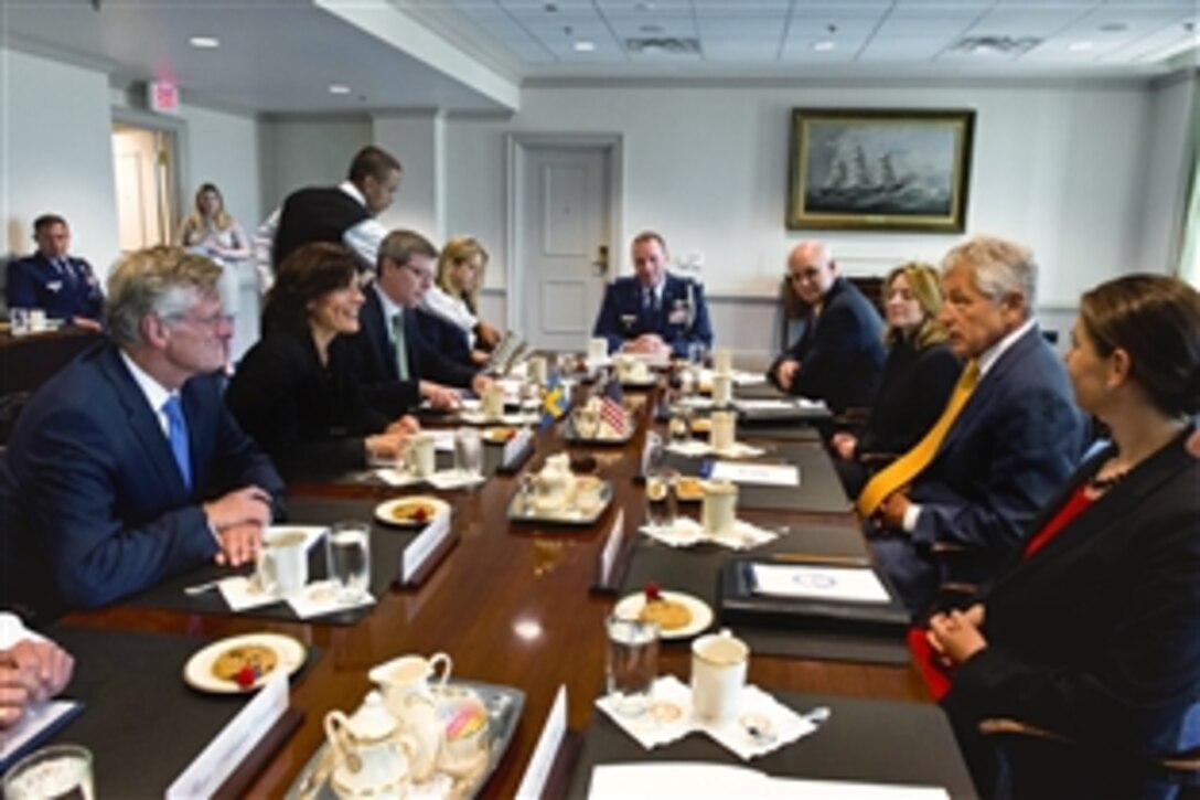 U.S. Defense Secretary Chuck Hagel meets with Swedish Defense Minister Karin Enstrom at the Pentagon, June 26, 2013. The leaders discussed issues of mutual interest and concern.