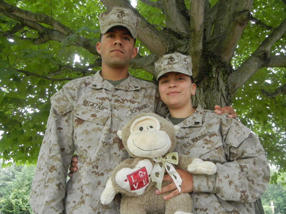 Cpl. Michelle Salazar, wireman and telephone investigator, Headquarters and Services Battalion, and her husband, Lance Cpl. Alejandro, wireman at the Communications School, hold the teddy bear of their late daughter, Alexa, aboard Marine Corps Base Quantico. After their two-month old daughter passed while sleeping in January, the couple made it their mission to help infants in need.                  