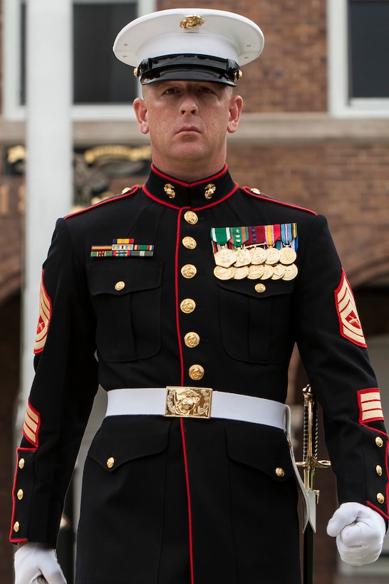 Gunnery Sgt. Kevin Pirtle, a parade staff member with Marine Barracks Washington, D.C., marches during a relief and appointment ceremony at the Barracks, June 27. Sgt. Maj. Angela M. Maness, the Barracks sergeant major, assumed her post after relieving Sgt. Maj. Eric J. Stockton, former Barracks sergeant major. Stockton retired during the ceremony after more than 30 years of service.