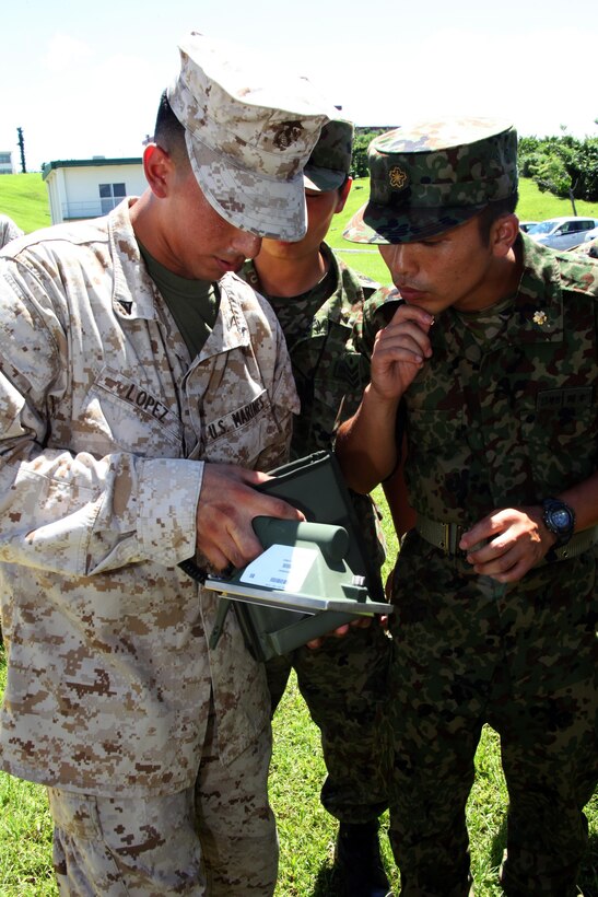 Lance Cpl. Adriel Lopez demonstrates to officers with the Japan Ground Self-Defense Force how to use an Alpha-Beta-Gamma-Neutron Detector AN/PDR-77 June 24 at Camp Courtney. The AN/PDR-77 RADIAC set is a portable radiation detector that has the capability of detecting and measuring alpha, beta, gamma, and low-energy x-ray radiation. Lopez and other chemical, biological, radiological, nuclear defense Marines trained with JGSDF officers as a way to promote interoperability in case of a natural or man-made disaster. The officers are with the Nuclear Biological Chemical Company, 15th Brigade, JGSDF and Lopez is a CBRN specialist with Headquarters Battalion, 3rd Marine Division, III Marine Expeditionary Force. (U.S. Marine Corps photo by Sgt. Brian A. Marion/Released)
