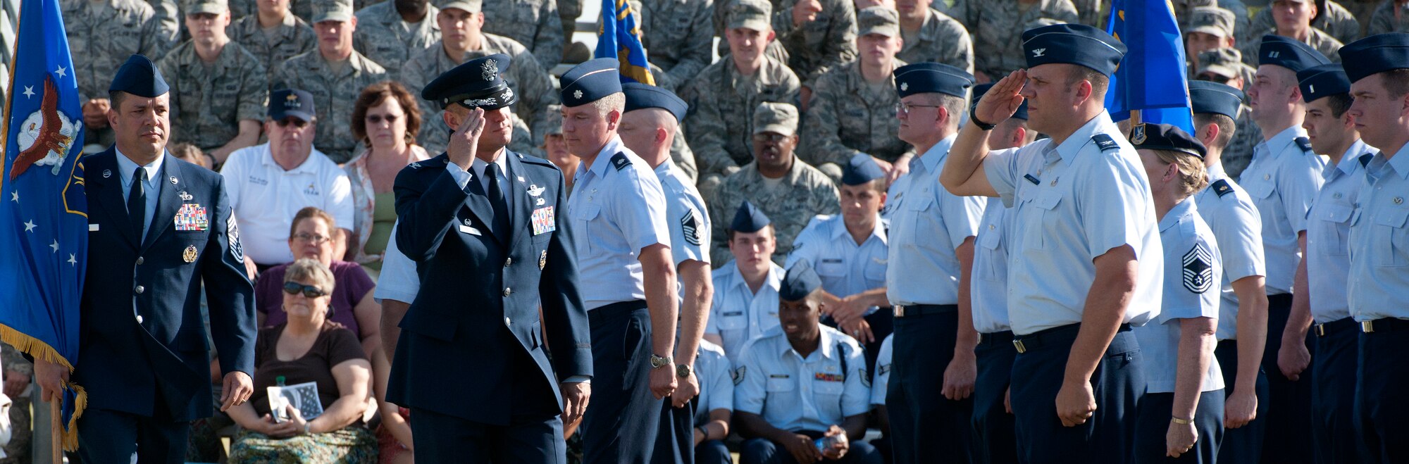 ALTUS AIR FORCE BASE, Okla. -- Col. Anthony B. Krawietz, 97th Air Mobility Wing commander, salutes the members of Altus AFB during the review of troops as part of the 97th AMW change of command ceremony at Wings of Freedom Park, June 27. It is customary for the senior officer to review the Airmen, but Gen. Edward A. Rice Jr., commander of Air Education and Training Command, deferred the honor to Krawietz. The review consisted of four stages: a formation of troops, presentation and honors, inspection, and a march in review. (U.S. Air Force photo by Senior Airman Jesse Lopez / Released)