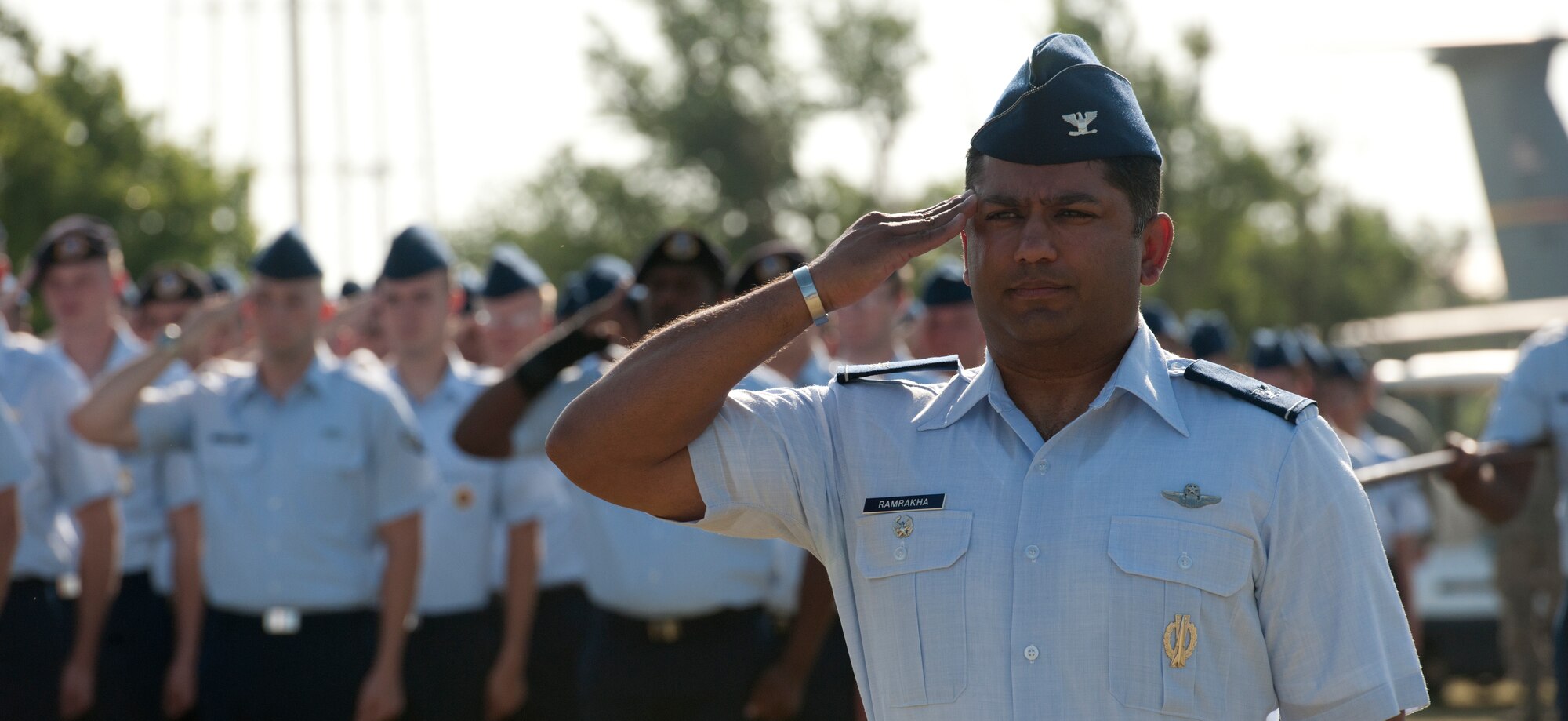 ALTUS AIR FORCE BASE, Okla. – Col. Sushil Ramrakha, 97th Air Mobility Wing vice commander, salutes during the playing of the colors as part of the 97th AMW change of command ceremony at Wings of Freedom Park, June 27. Ramrakha served as the Commander of Airmen as Col. Anthony B. Krawietz, 97th AMW commander, relinquished command to Col. William A. Spangenthal, incoming 97th AMW commander. (U.S. Air Force photo by Senior Airman Jesse Lopez / Released)