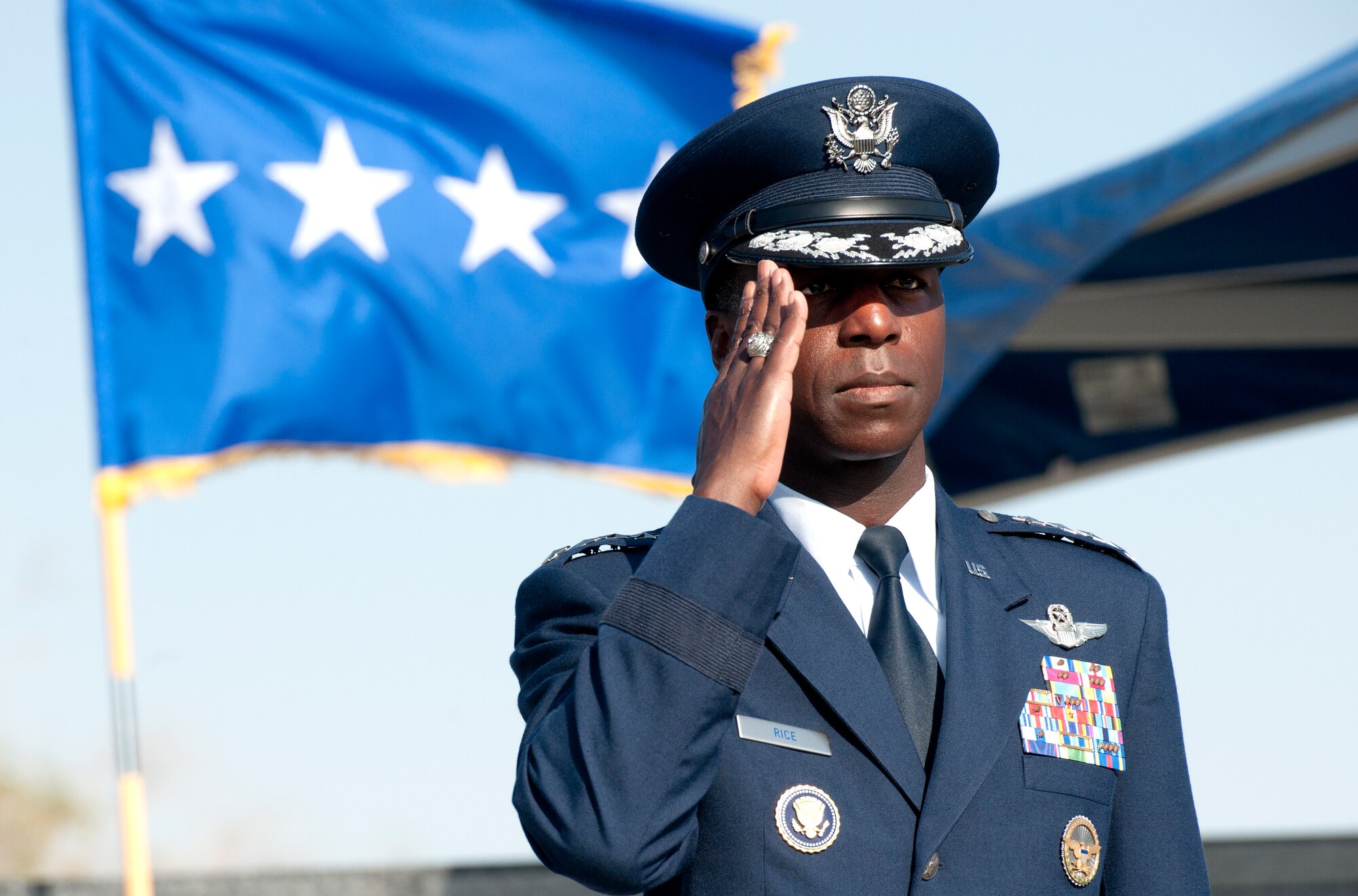 ALTUS AIR FORCE BASE, Okla. -- Gen. Edward A. Rice Jr., commander of Air Education and Training Command, salutes the members of Altus AFB during the 97th Air Mobility Wing change of command ceremony, at Wings of Freedom Park, June 27. Gen. Rice served as the reviewing officer as Col. Anthony B. Krawietz, 97th AMW commander relinquished command to Col. William A. Spangenthal. Rice is responsible for the recruiting, training and educating Air Force personnel. His command includes the Air Force Recruiting Service, a numbered air force and Air University. AETC trains more than 293,000 students per year and consists of 12 bases, more than 67,900 active-duty, Reserve, Guard, civilians and contractors, and 1,369 trainer, fighter and mobility aircraft. (U.S. Air Force photo by Senior Airman Jesse Lopez / Released)