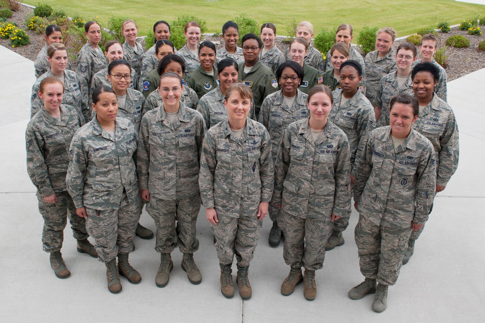 Col. Marné Deranger, 341st Missile Wing vice commander, center, along with more than 30 women assigned to Malmstrom Air Force Base, pose for a photo June 19 at the Grizzly Bend. April 2013 to 2014 is being recognized as Year of Military Women. The year-long event will honor women serving in all branches of the U.S. Armed Forces.  (U.S. Air Force photo/Beau Wade)